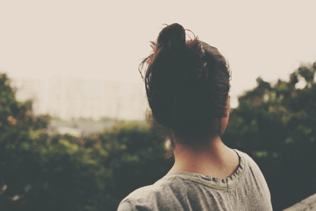 A woman looks over a hillside contemplating whether she could fight the sex trade.