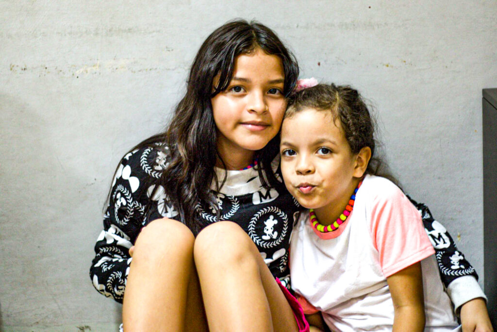 older and younger girl at Casa de Sueños.