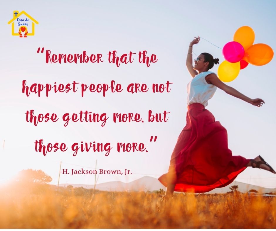 A woman with balloons dancing in a field: "Remember that the happiest people are not those getting more, but those giving more." H. Jackson Brown, Jr.