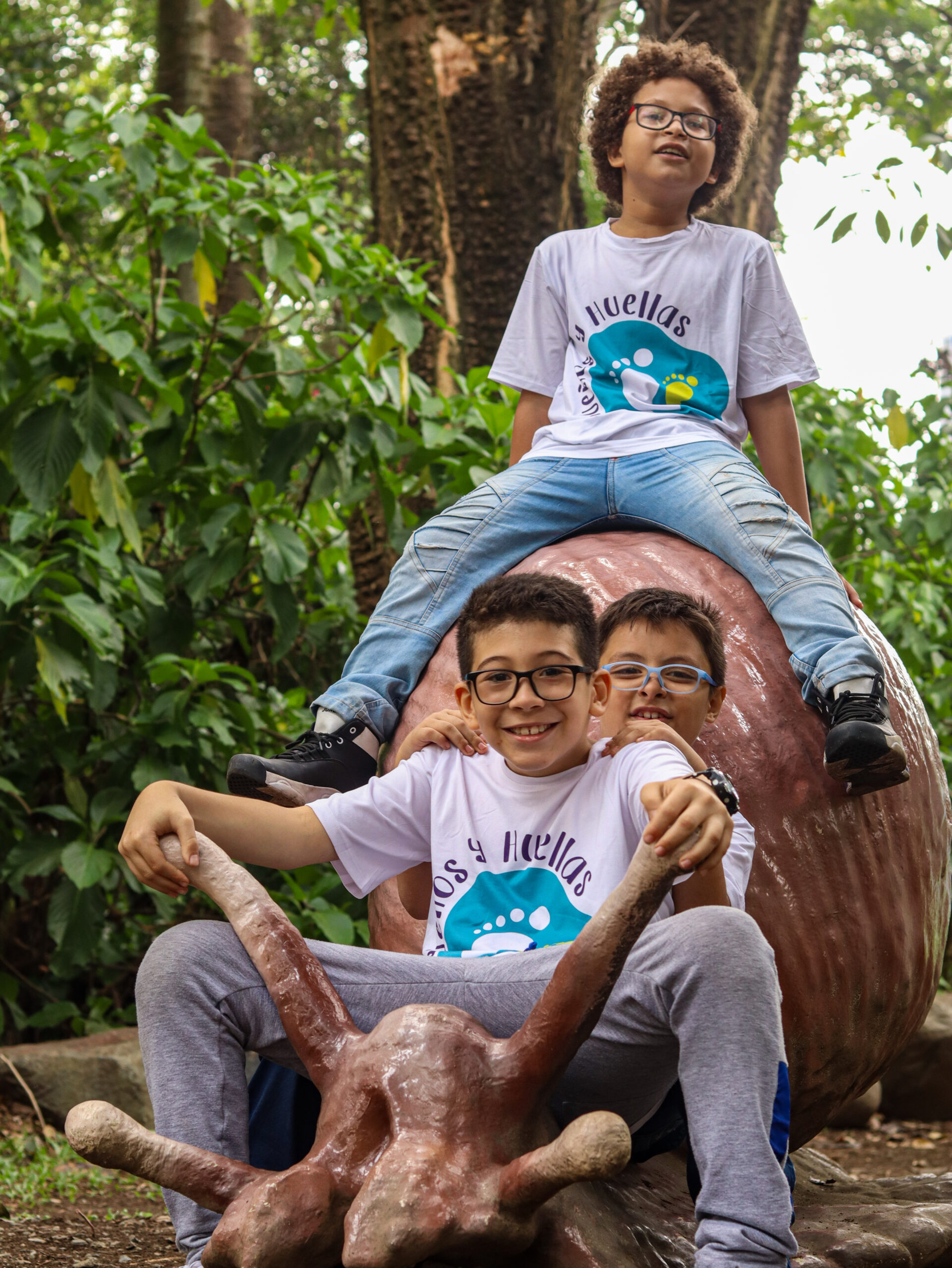 3 boys, kids from Casa de Suenos, building friendships while on a trip to the zoo